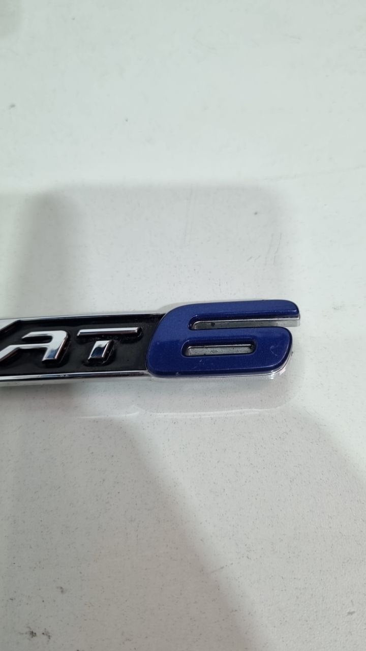 Emblema AT6 Tras Fiat Argo 2017/2021