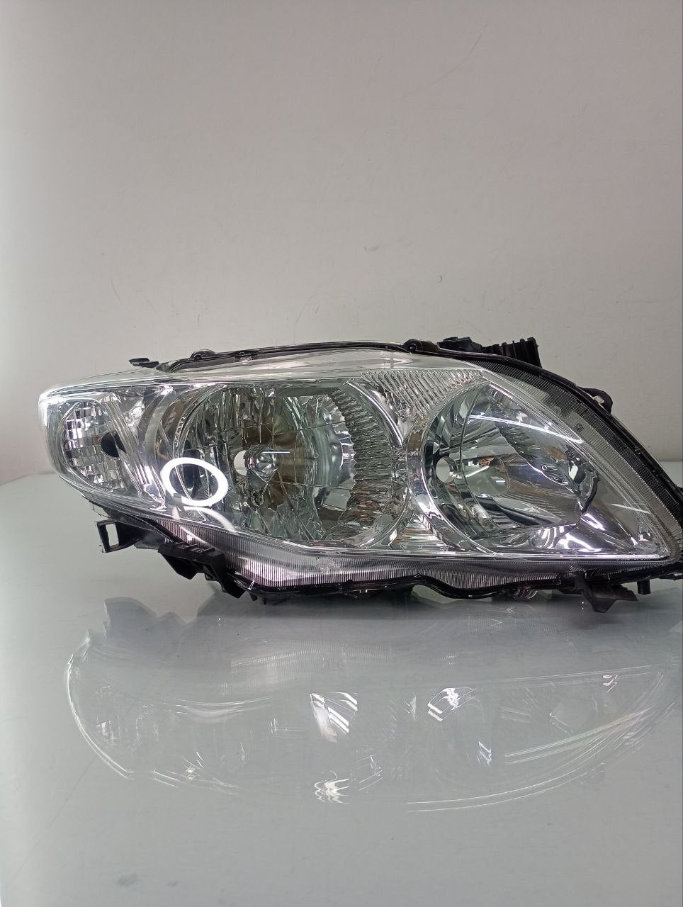 Farol direito corolla 2008/2010
Cromado TYC