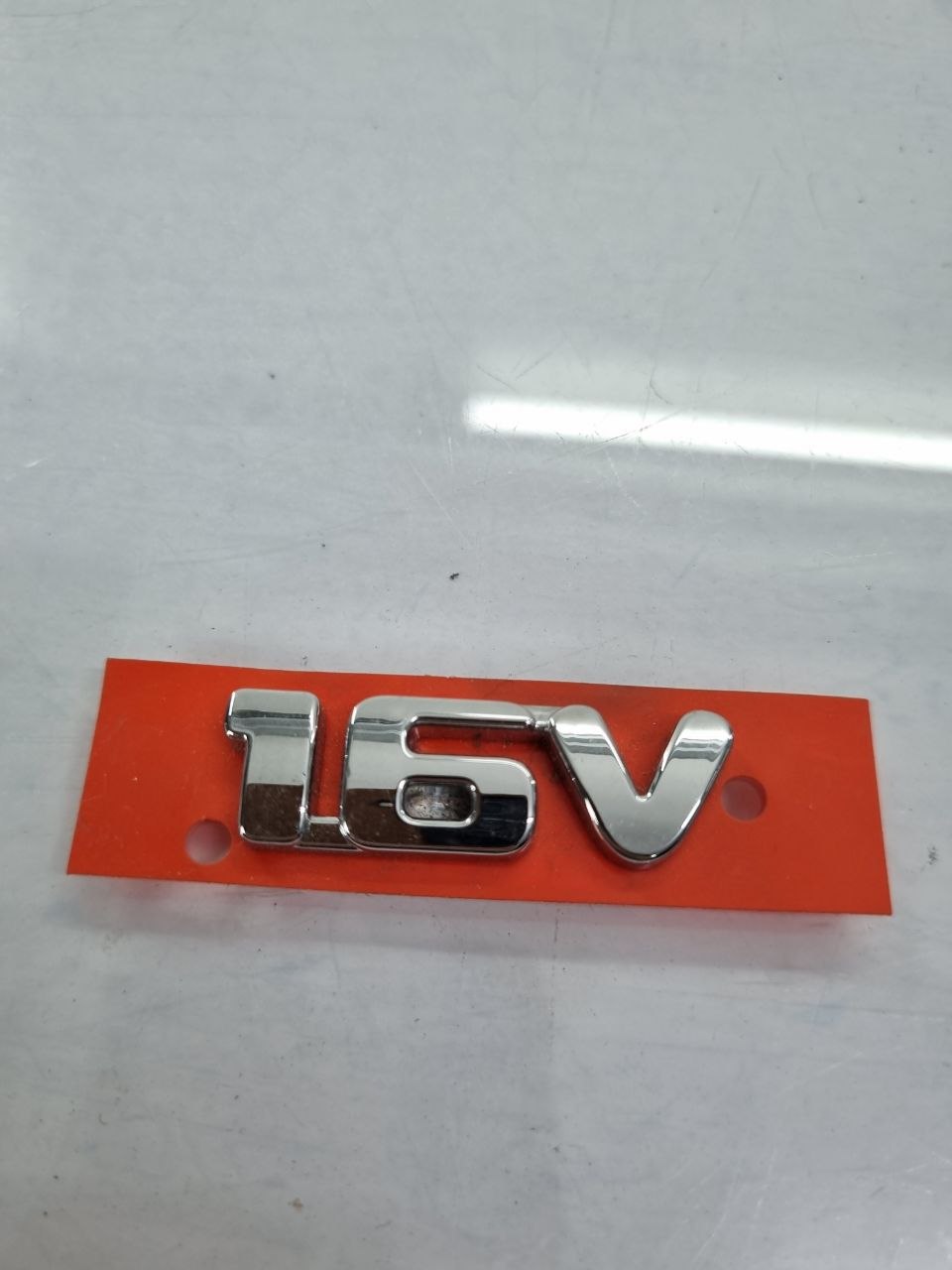 Emblema 1.6V Cromado Fiat Palio Strada Idea Punto Grand Siena 2011/2016 Novo