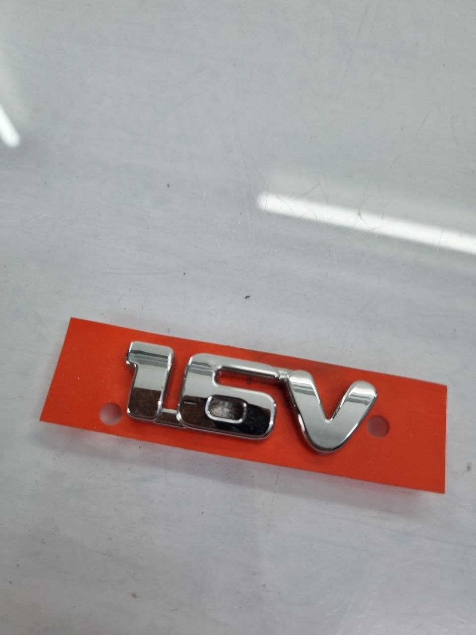 Emblema 1.6V Cromado Fiat Palio Strada Idea Punto Grand Siena 2011/2016 Novo