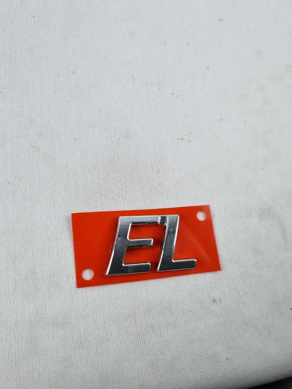 Emblema EL Tampa Traseira Fiat Siena/Strada 1996/2004