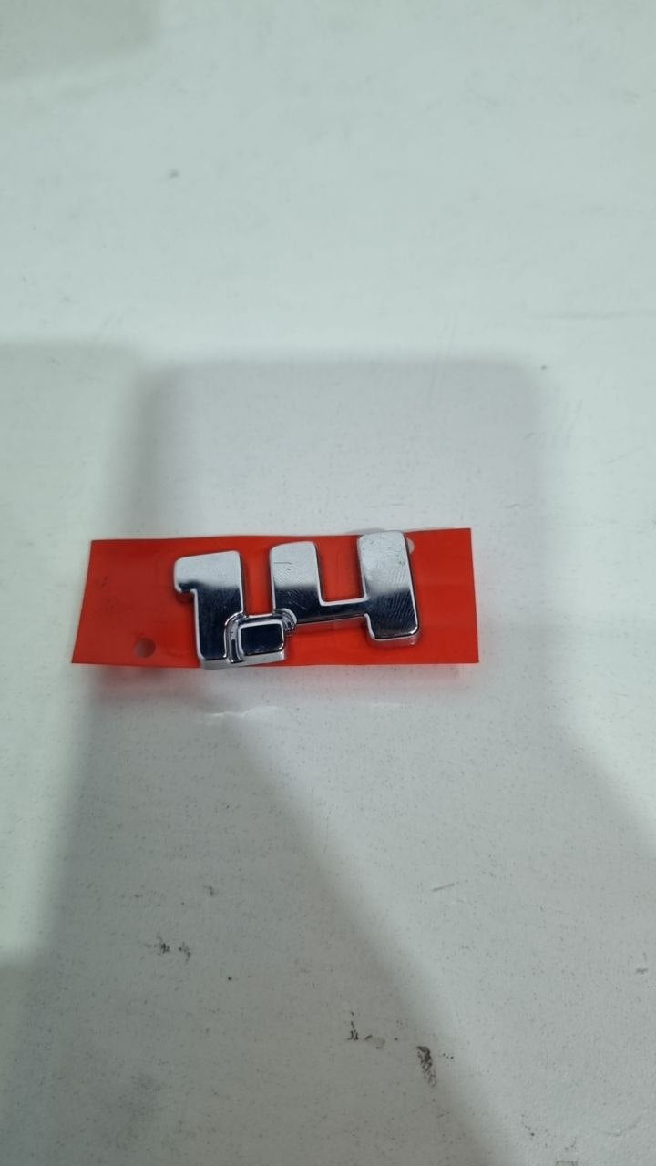 Emblema Tras 1.4 Fiat Strada Palio Siena Uno 2000/2023
