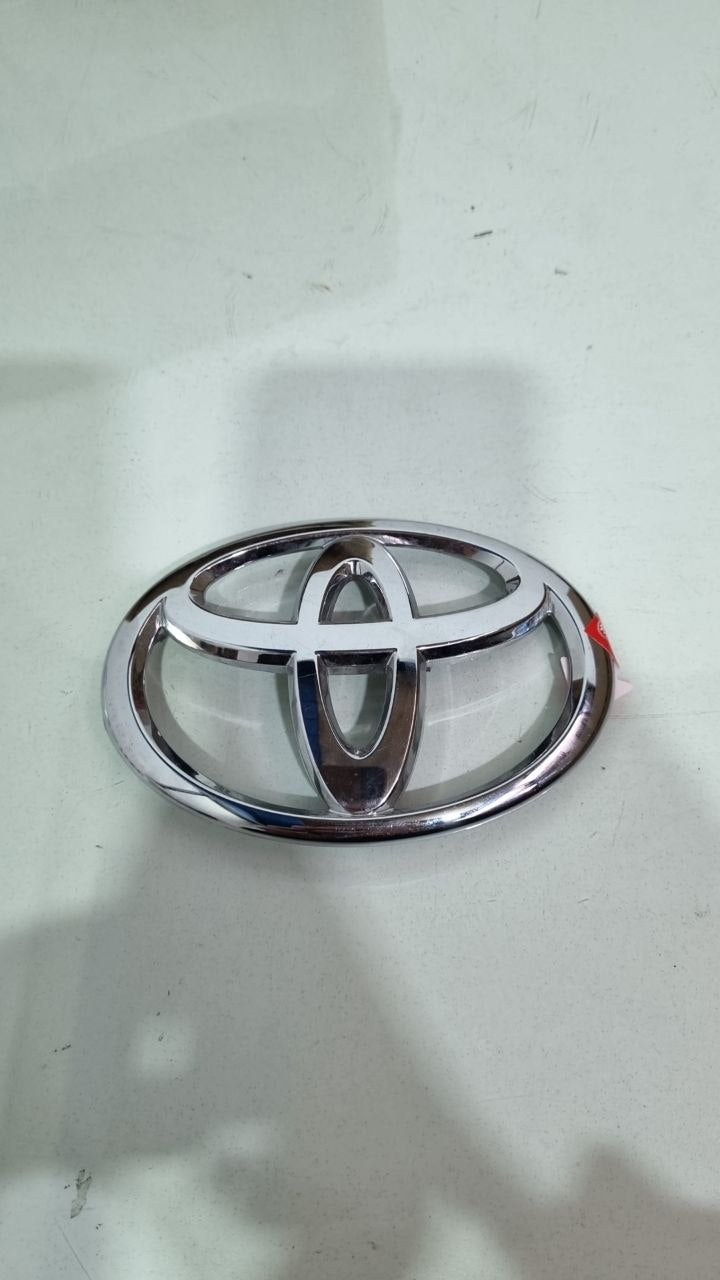 Emblema Diant Toyota Yaris/Hilux 2005/2020
