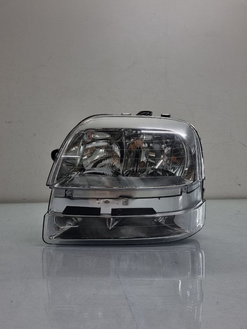 Farol lado esquerdo cromado com auxiliar doblo 2002 a 2010
