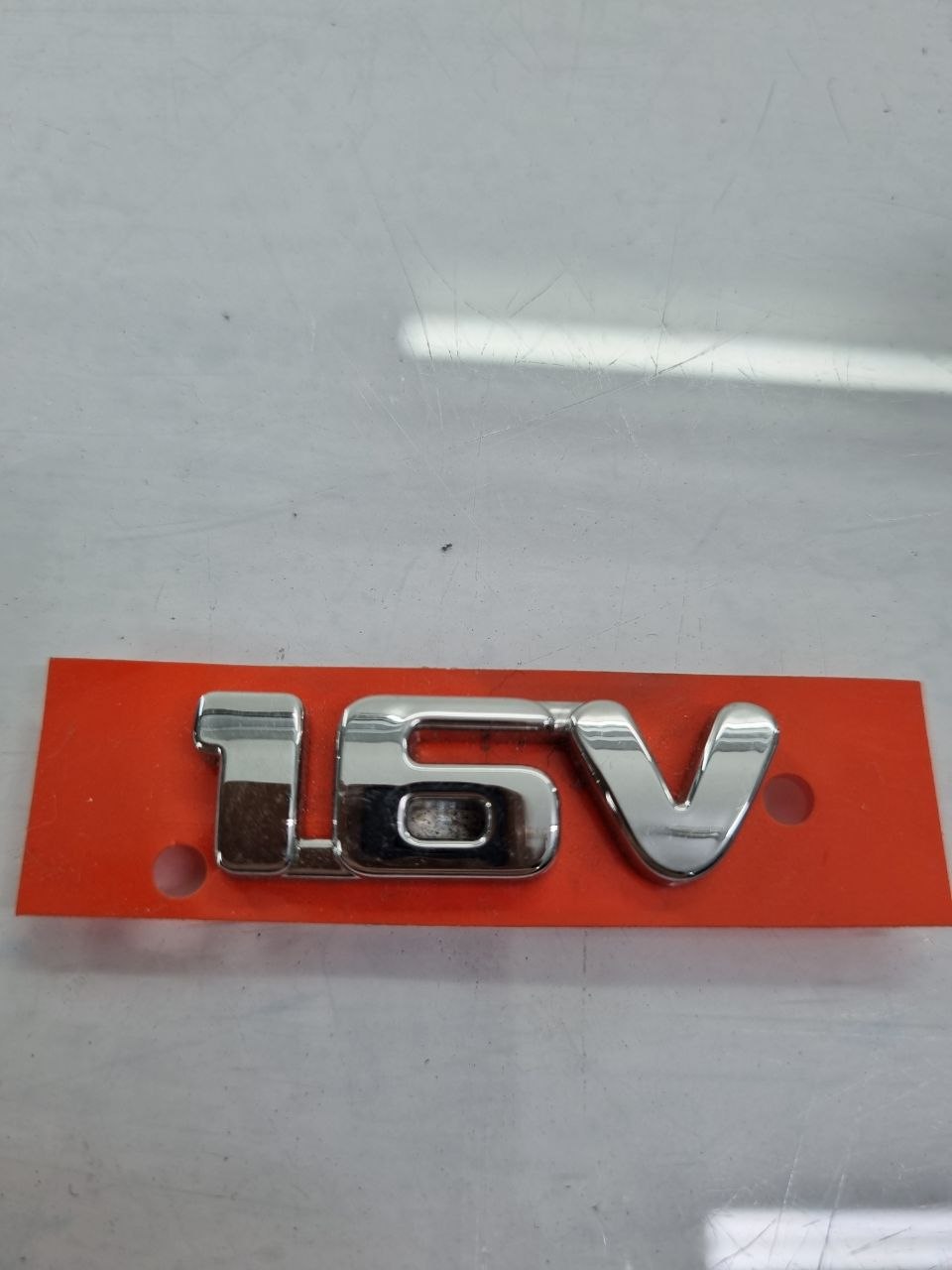 Emblema 1.6V Cromado Fiat Palio Strada Idea Punto Grand Siena 2011/2016 Novo