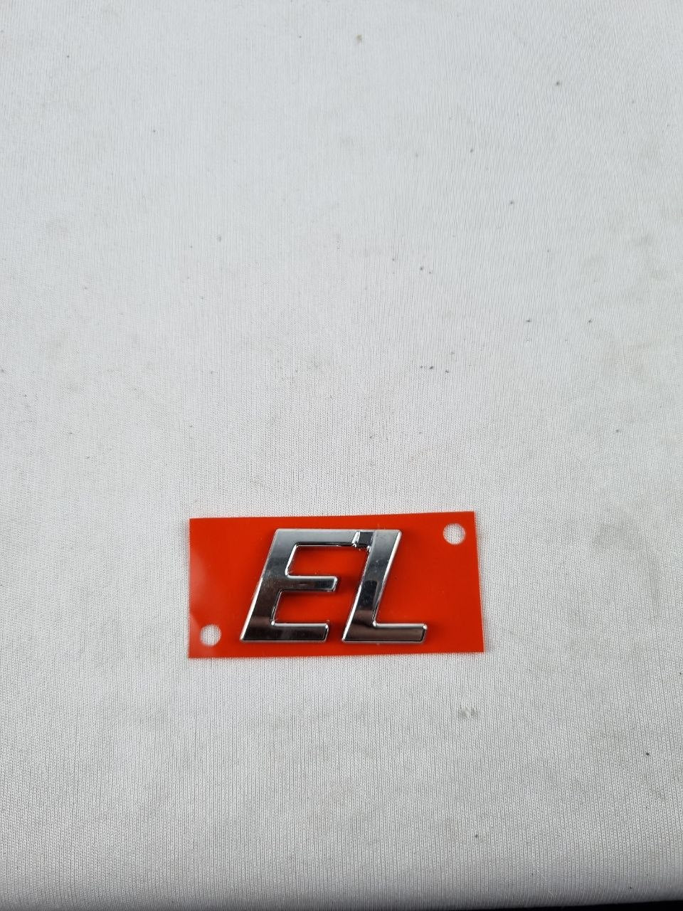 Emblema EL Tampa Traseira Fiat Siena/Strada 1996/2004