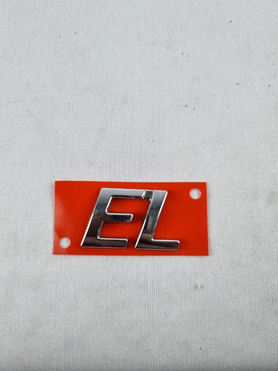 Emblema EL Tampa Traseira Fiat Siena/Strada 1996/2004