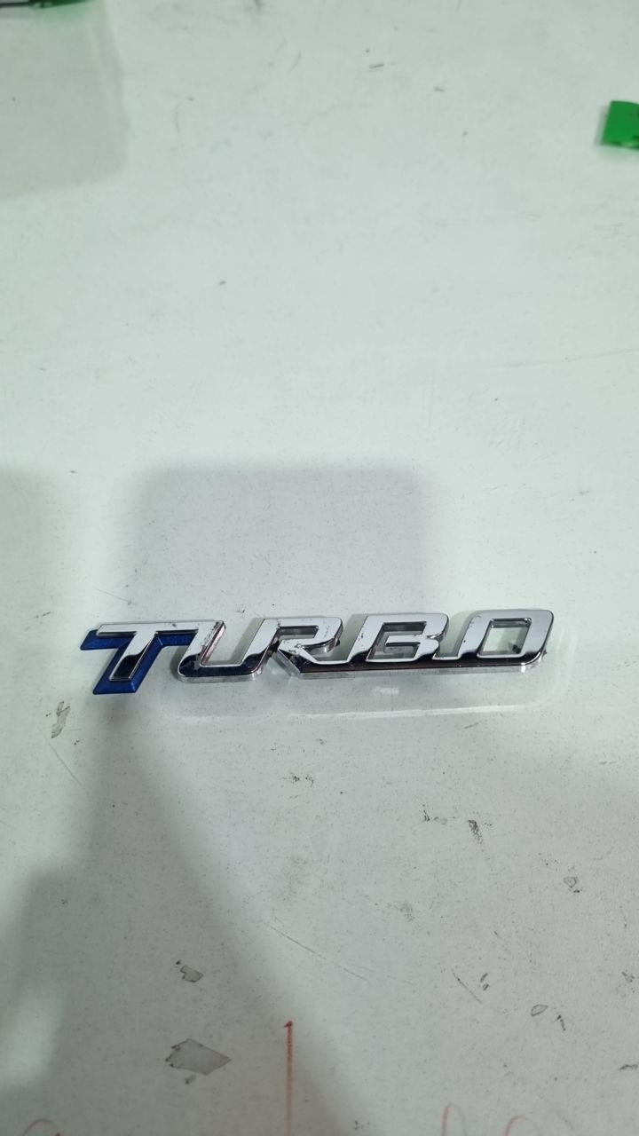 Emblema Turbo Tampa Tras Chevrolet Onix/Tracker 2020/2024