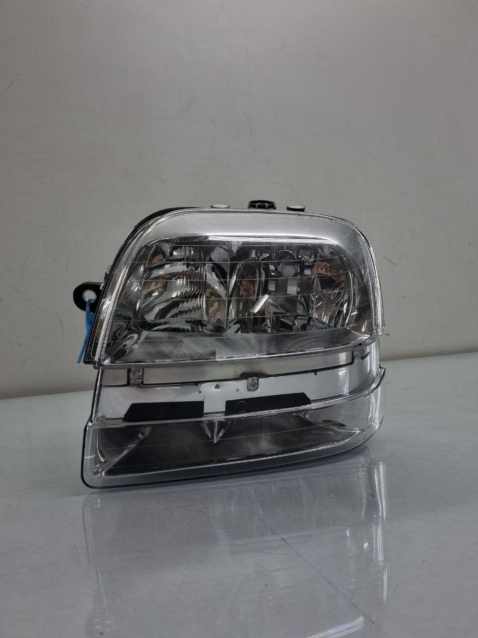Farol lado esquerdo cromado com auxiliar doblo 2002 a 2010