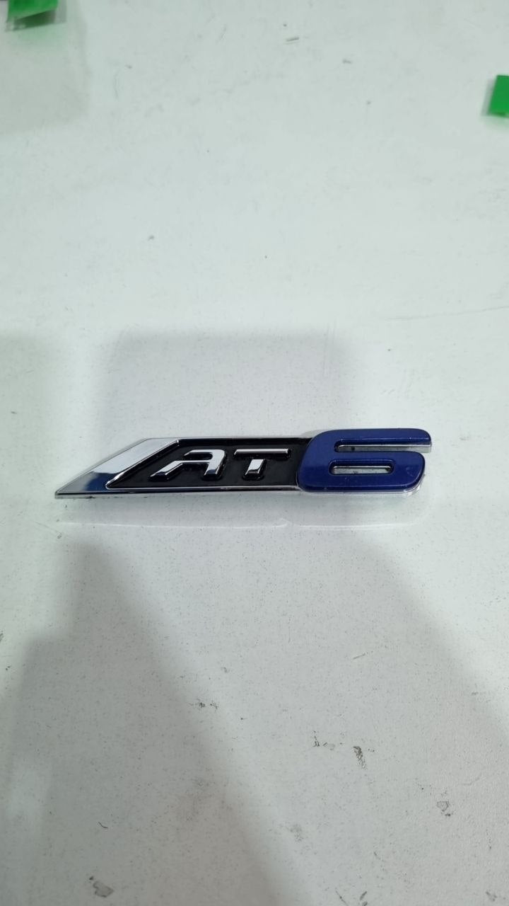 Emblema AT6 Tras Fiat Argo 2017/2021