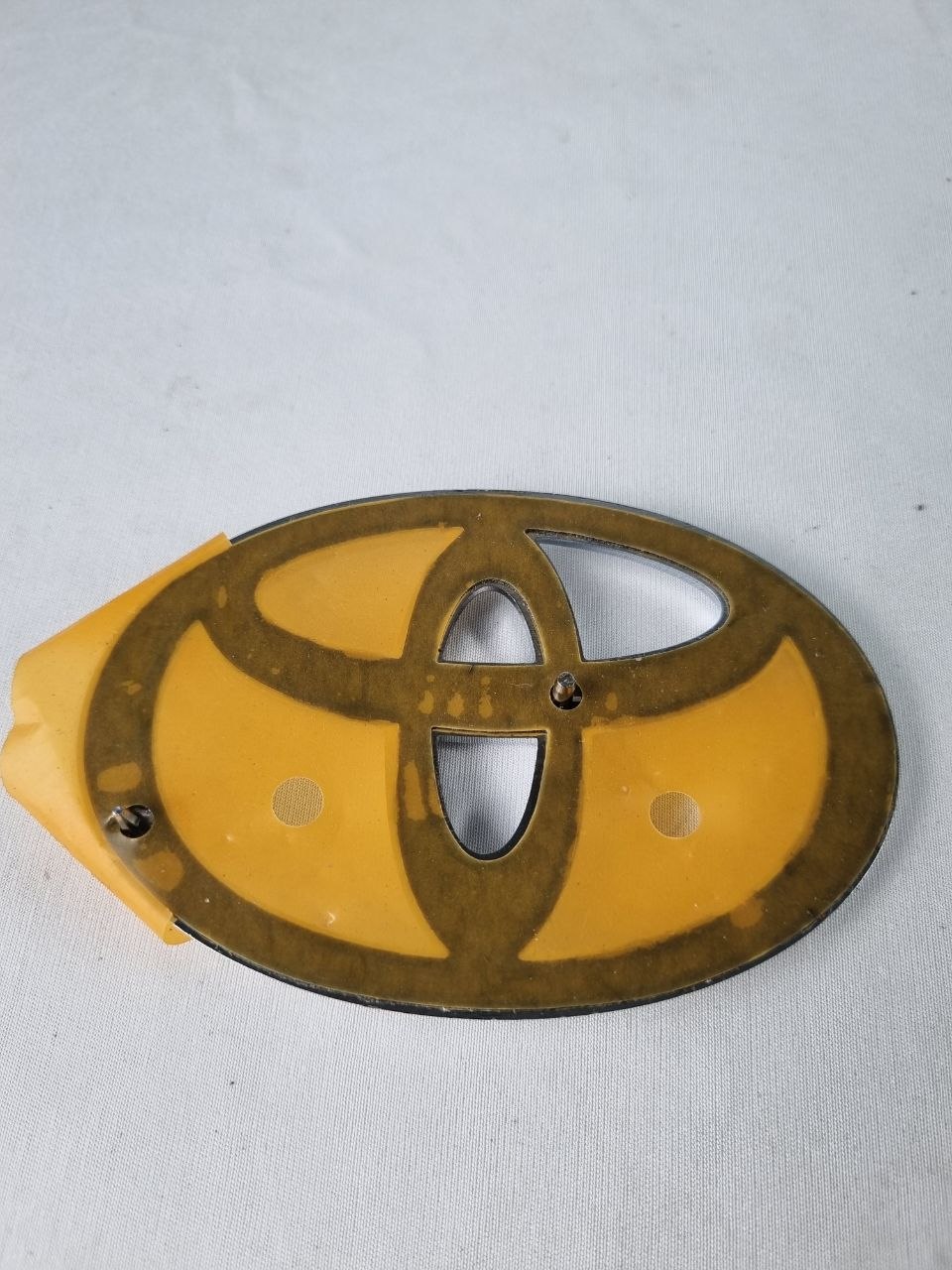 Emblema Diant Toyota Corolla/Camry/RAV4 2014/2023