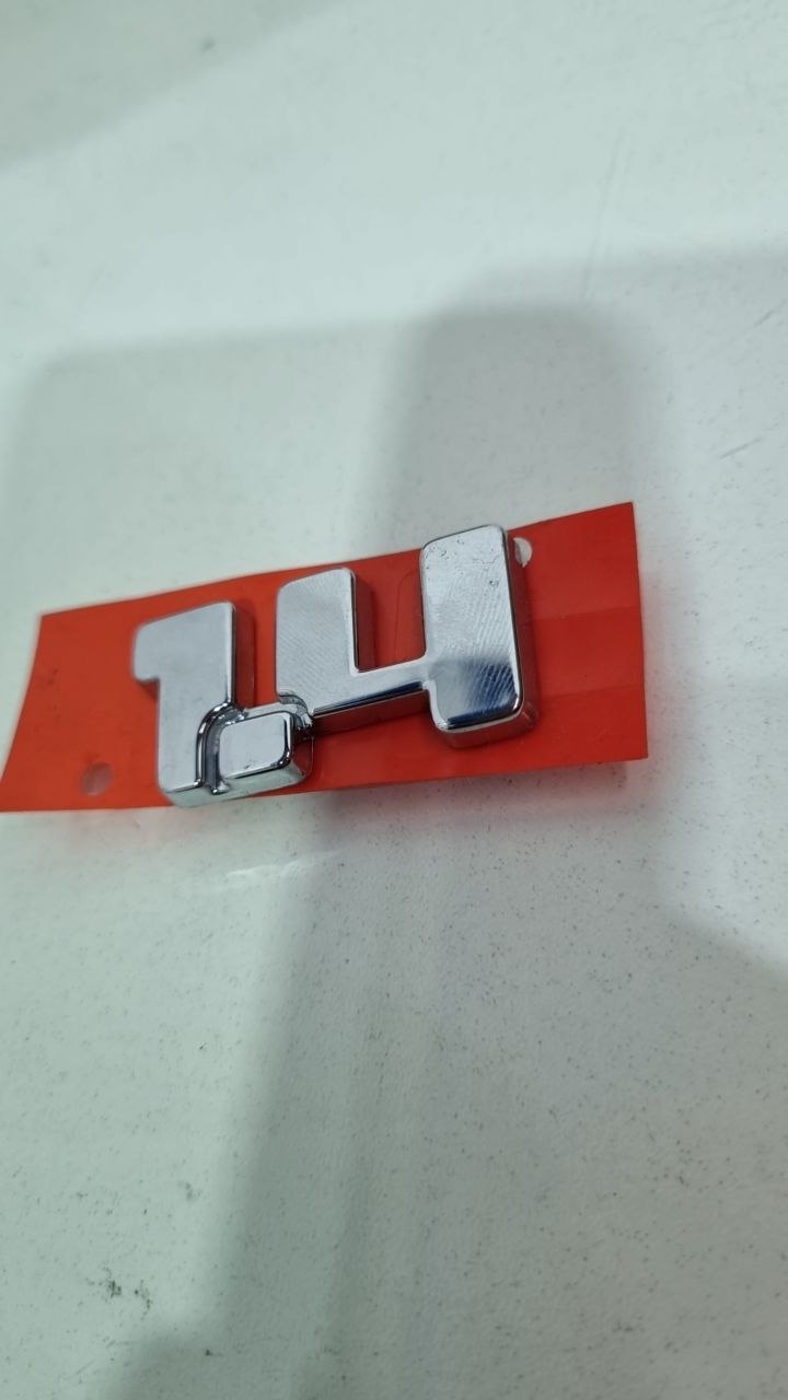 Emblema Tras 1.4 Fiat Strada Palio Siena Uno 2000/2023